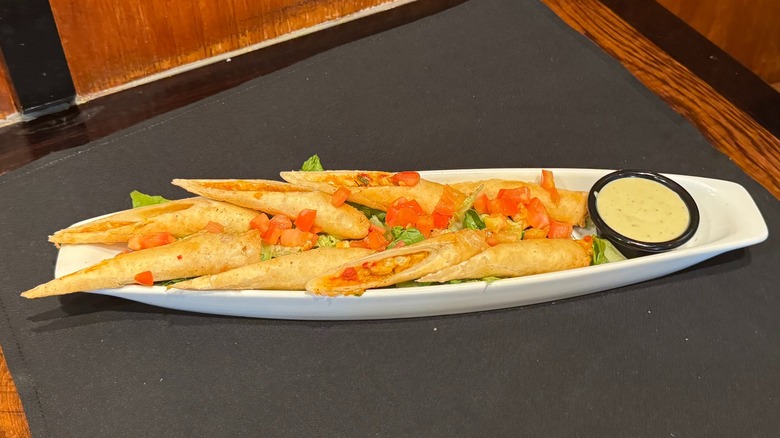 LongHorn Steakhouse's Firecracker Chicken Wraps on black napkin