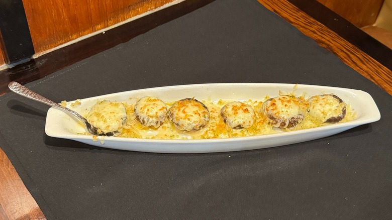 LongHorn Steakhouse's White Cheddar Stuffed Mushrooms on black napkin