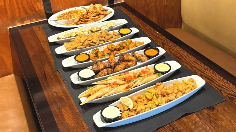 LongHorn Steakhouse appetizers lined up on wooden table