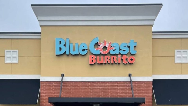 A storefront with a large Blue Coast Burrito logo.