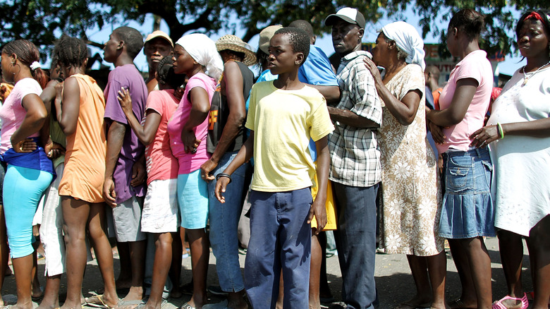 Haitians waiting in line for food distributions