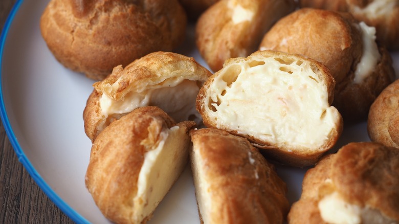 Cream-filled pastries on a plate
