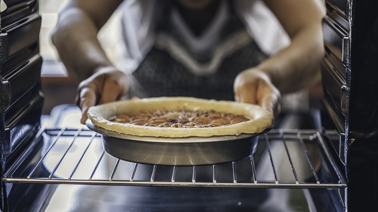 putting pie in the oven