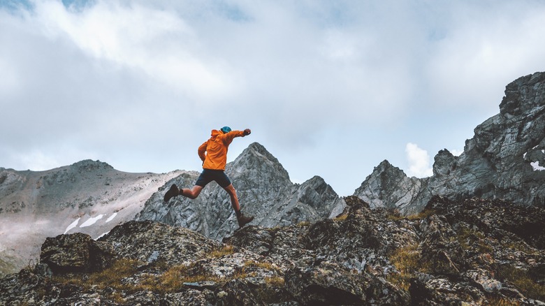 Person running in rocky terrain