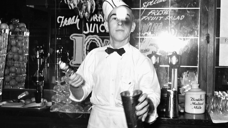 Server tosses ice cream to make milkshake