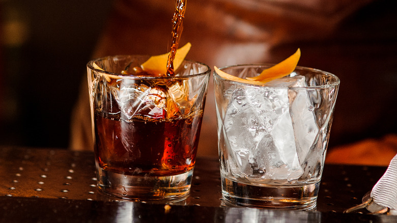 Pouring Old Fashioned into glass