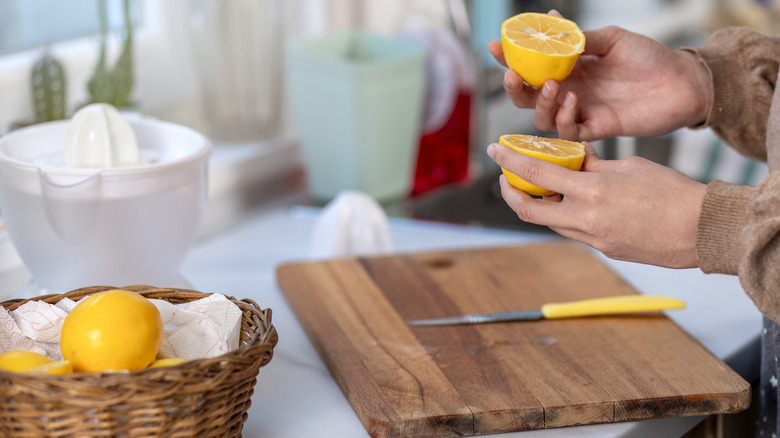 slicing lemons on cutting board