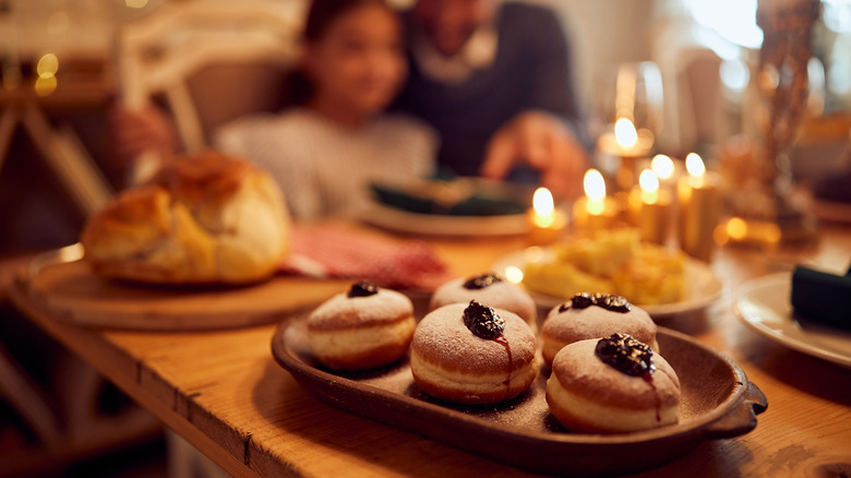 Sufganiyot with family in background