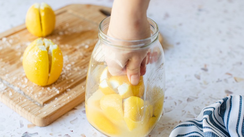 packing preserved lemons into jar