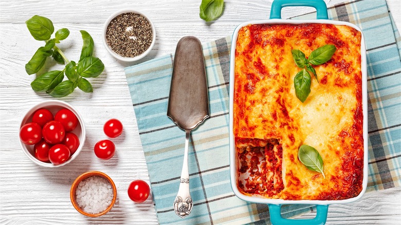 Pan of lasagna with serving utensil