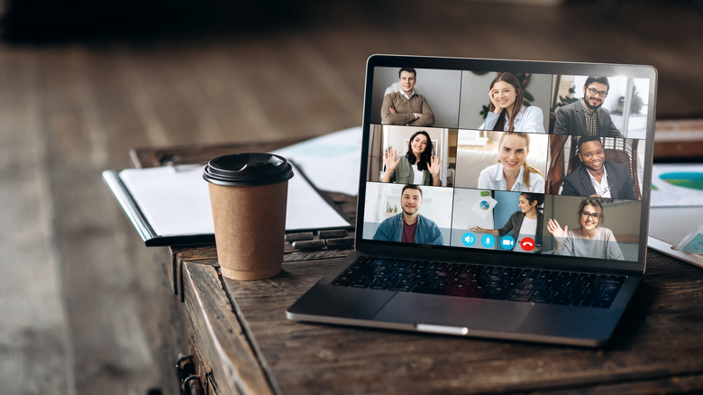 People on webcam with cup of coffee