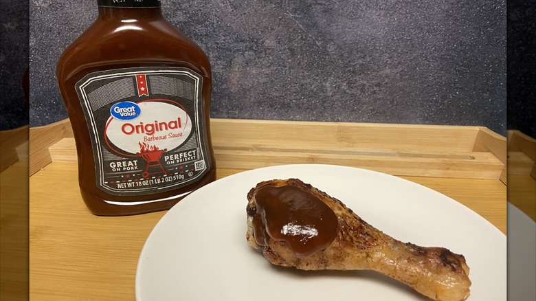 Great Value barbecue sauce on chicken drumstick
