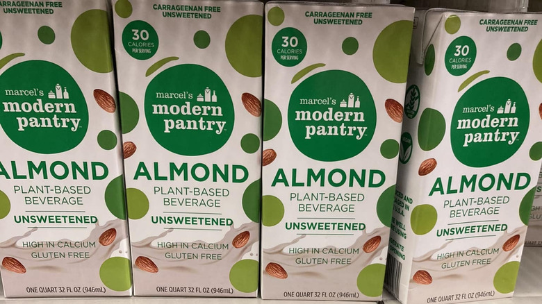 View of Marcel's Modern Pantry almond milk cartons lined up on a store shelf