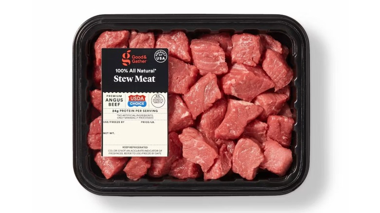 Good & Gather pre-packaged cubed raw stew meat on a whiute background