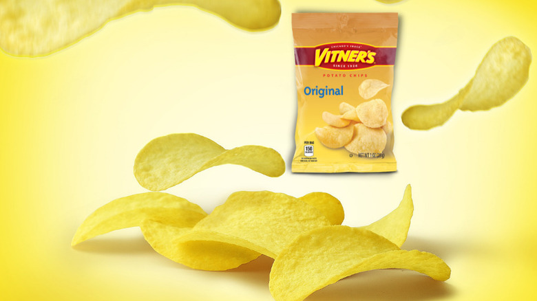 bag of vitner's potato chips styled with floating chips against yellow background