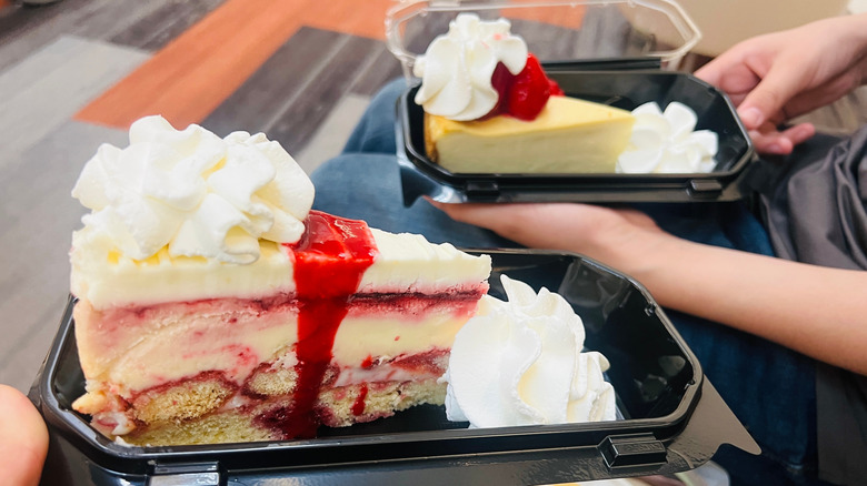 Cheesecake slices in plastic takeout boxes