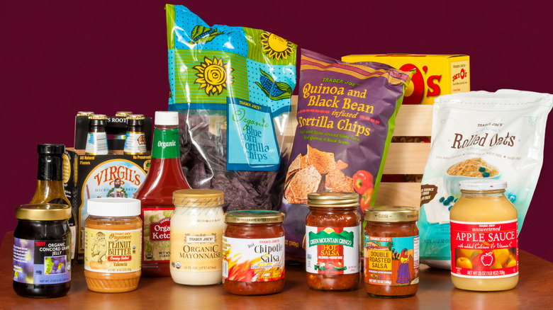 Assortment of Trader Joe's products against a maroon background