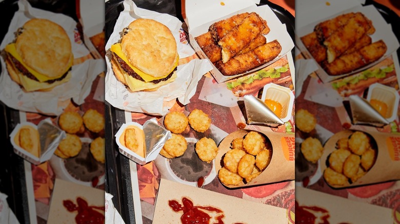 Burger King tray with a breakfast biscuit, French toast sticks, and hash browns