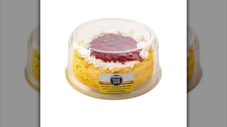 Strawberry tres leches cake on white background