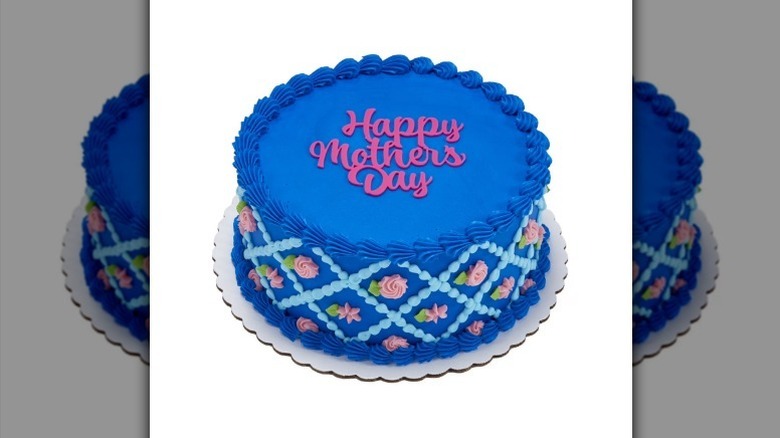 Blue round Mother's Day cake on white background