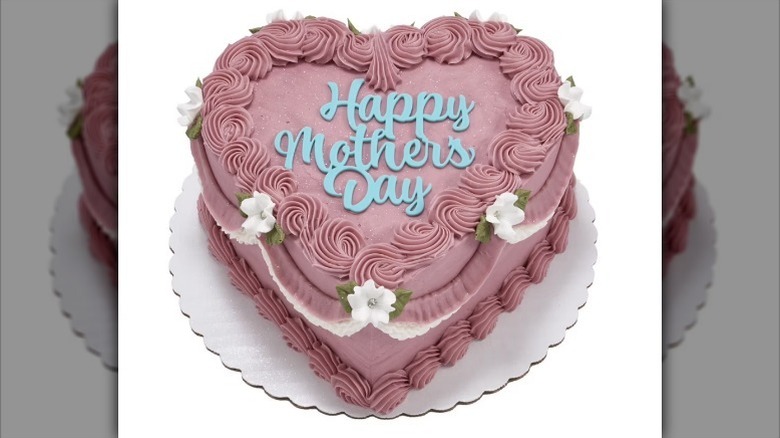 Pink heart Mother's Day cake on white background