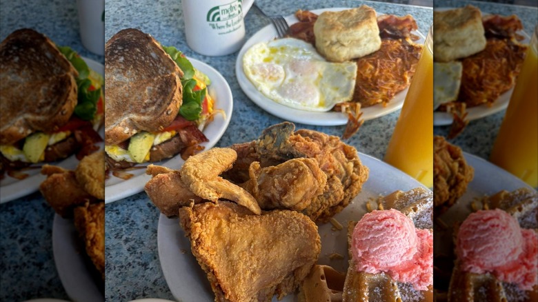Chicken and waffles, BLT sandwich, and breakfast platter with orange juice and coffee at Metro Diner