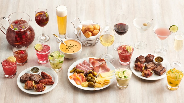 Variety of meats, veggies, and hot items with cocktails and beer available at Texas de Brazil