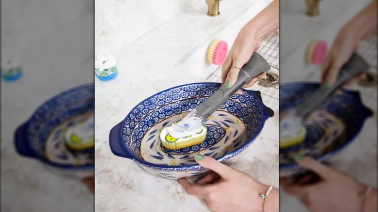 woman cleaning dirty dishes