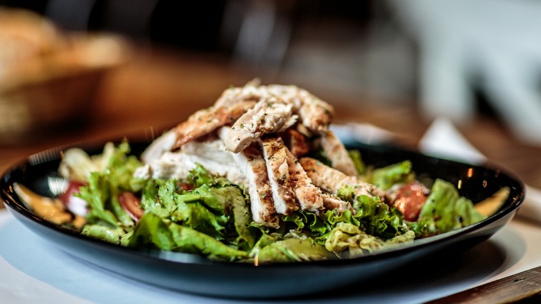 Green salad with chicken on top