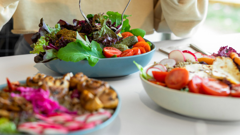 Salad bowl with chicken greens and tomatoes
