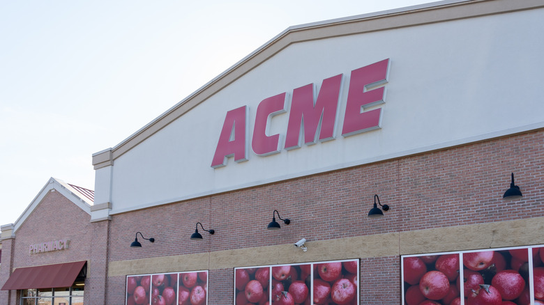 ACME storefront on a brick and white building