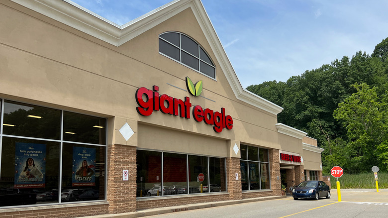 Giant Eagle storefront with a beige exterior and green trees surrounding