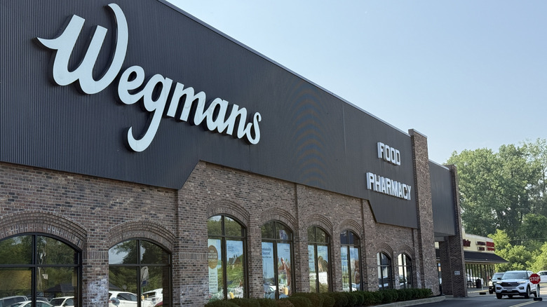 The black and brown brick storefront of a Wegmans storefront