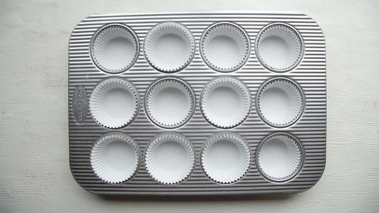 muffin pan with white paper liners