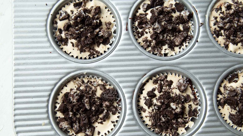 ice cream and cookie pieces in muffin cups
