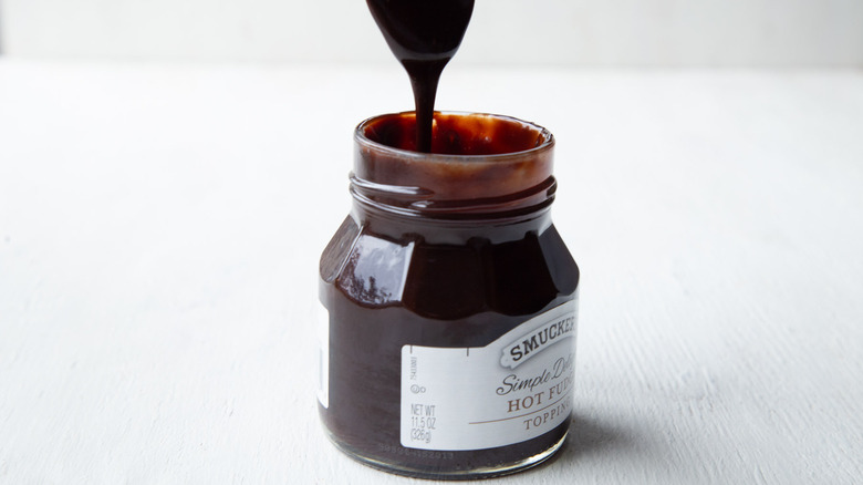 jar of fudge sauce with spoon