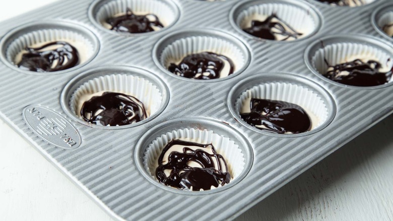 ice cream and fudge sauce in muffin cups