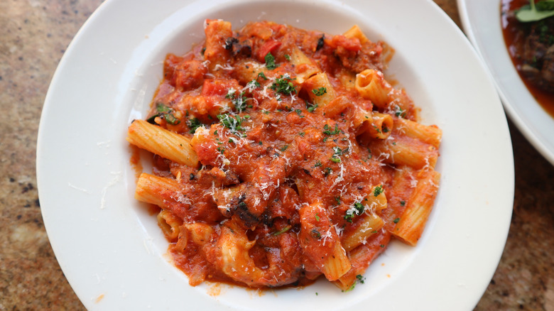 A pasta dish from The Cheesecake Factory in a white bowl