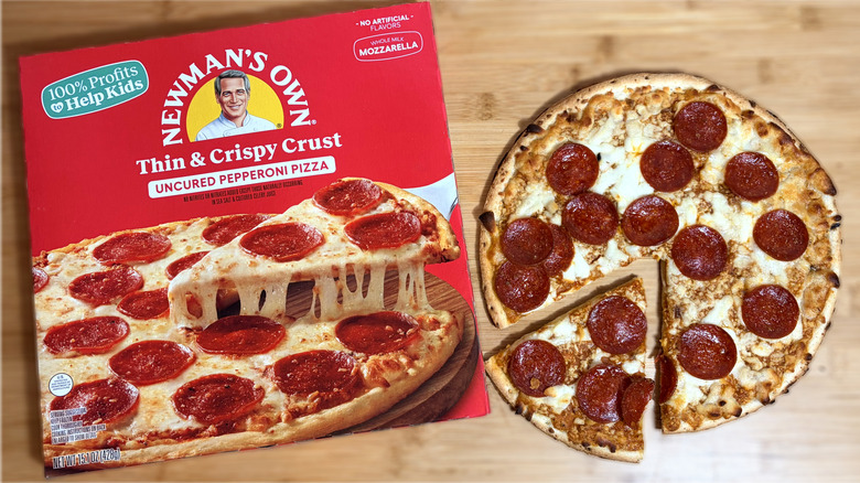 boxed newman's own pepperoni pizza on left and cooked pizza on right