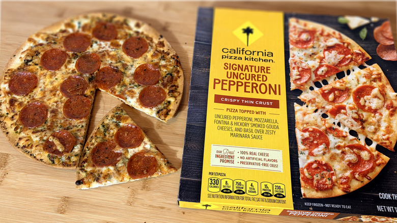 cooked cpk pepperoni pizza on left and boxed pizza on right