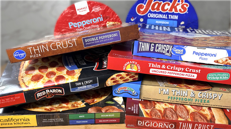 stacked boxes and packages of frozen pizza