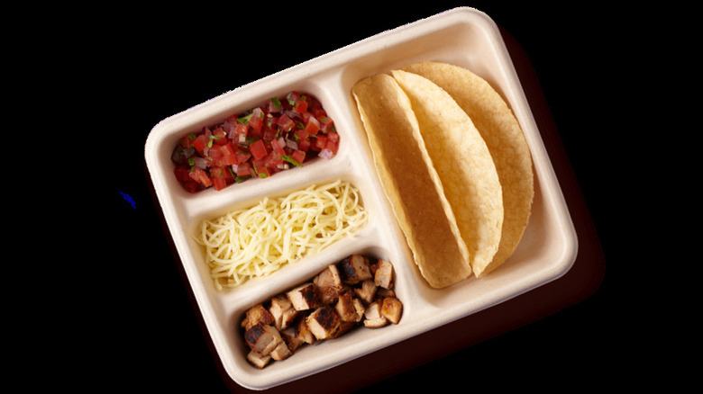 Kid's build your own meal from Chipotle on a black table