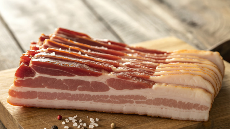 Bacon sitting on a cutting board