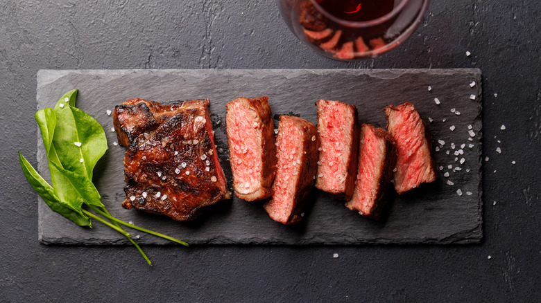 An overhead view of a rare sliced steak