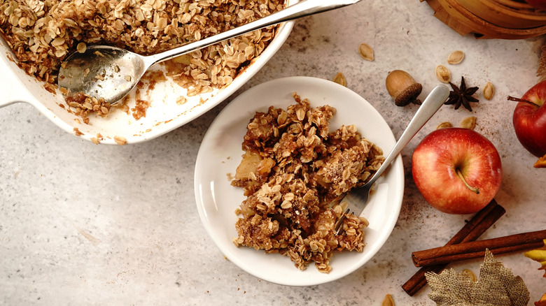 Overview of apple crisp in serving dish and bowl