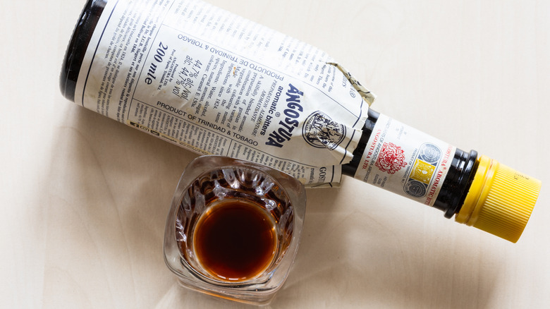 Overview of Angostura bitters bottle with glass