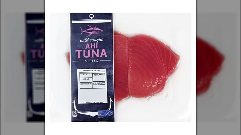 Vacuum-sealed package of frozen wild-caught ahi tuna steaks.