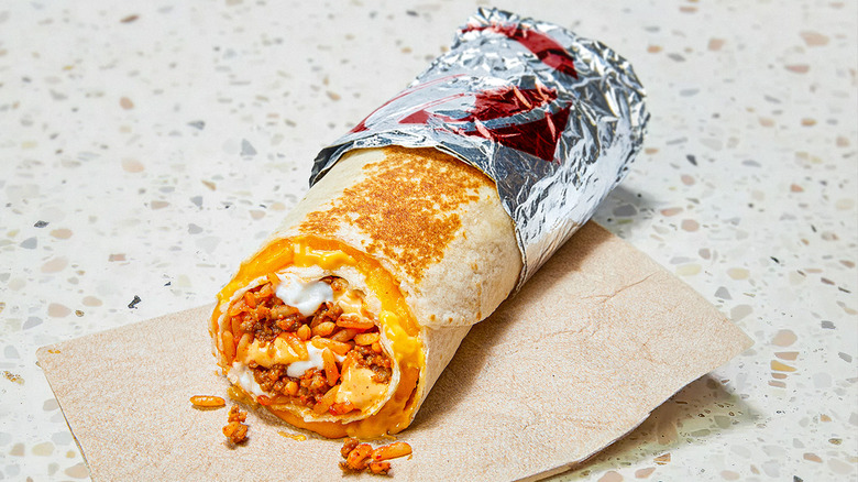 Half-unwrapped Taco Bell Quesarito on napkin