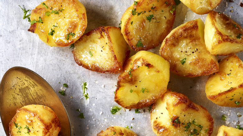 A tray of freshly roasted, golden potatoes