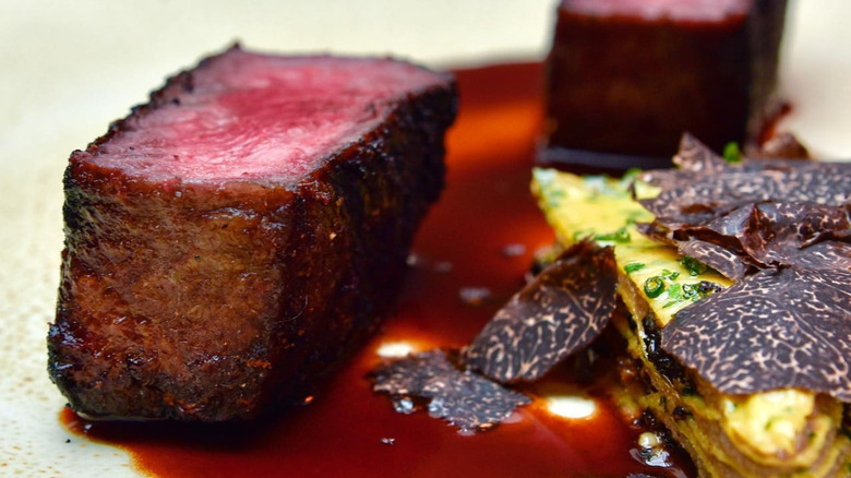 Wagyu steak with morel mushroom layer cake and truffles.